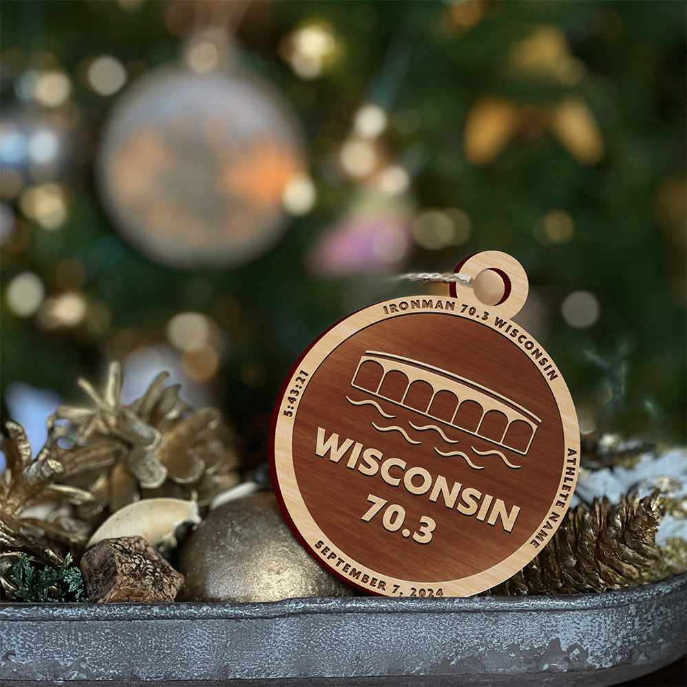 Ironman 70.3 Wisconsin Christmas ornament. The ornament is laser engraved and personalized with the athletes name and finish time.